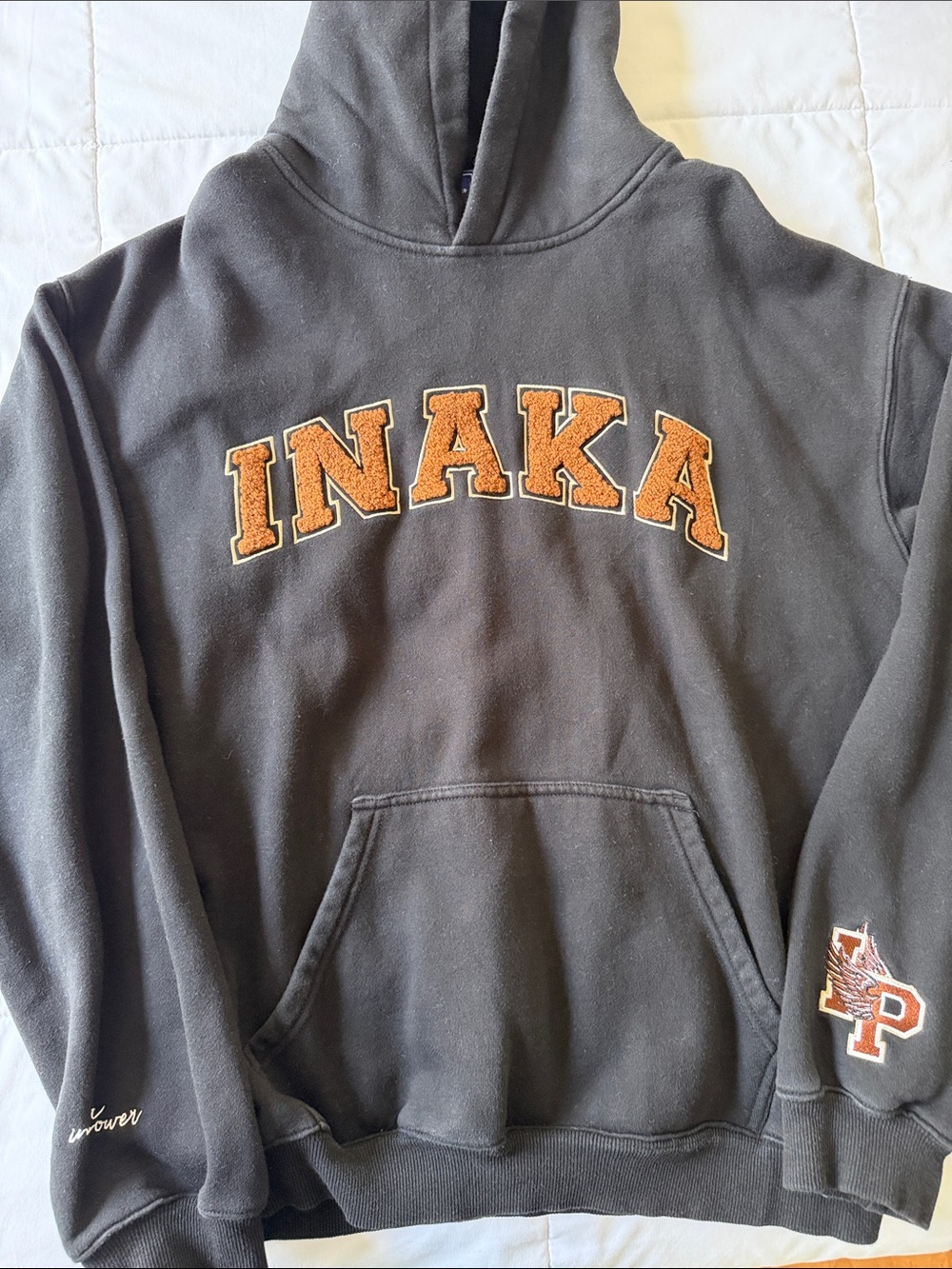 Inaka Power Black Hoodie with Brown Lettering